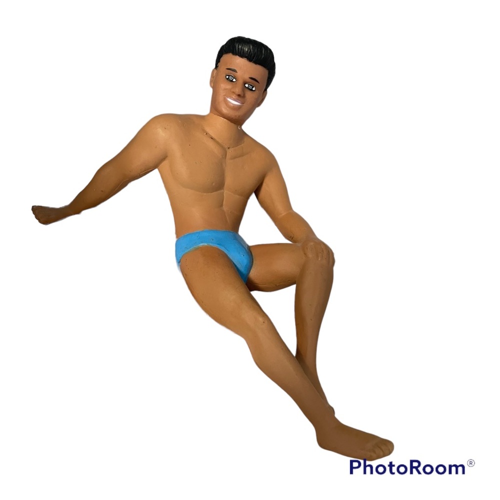 Man in Swim Trunks about 6 inches tall sitting on the beach Plastic decoration